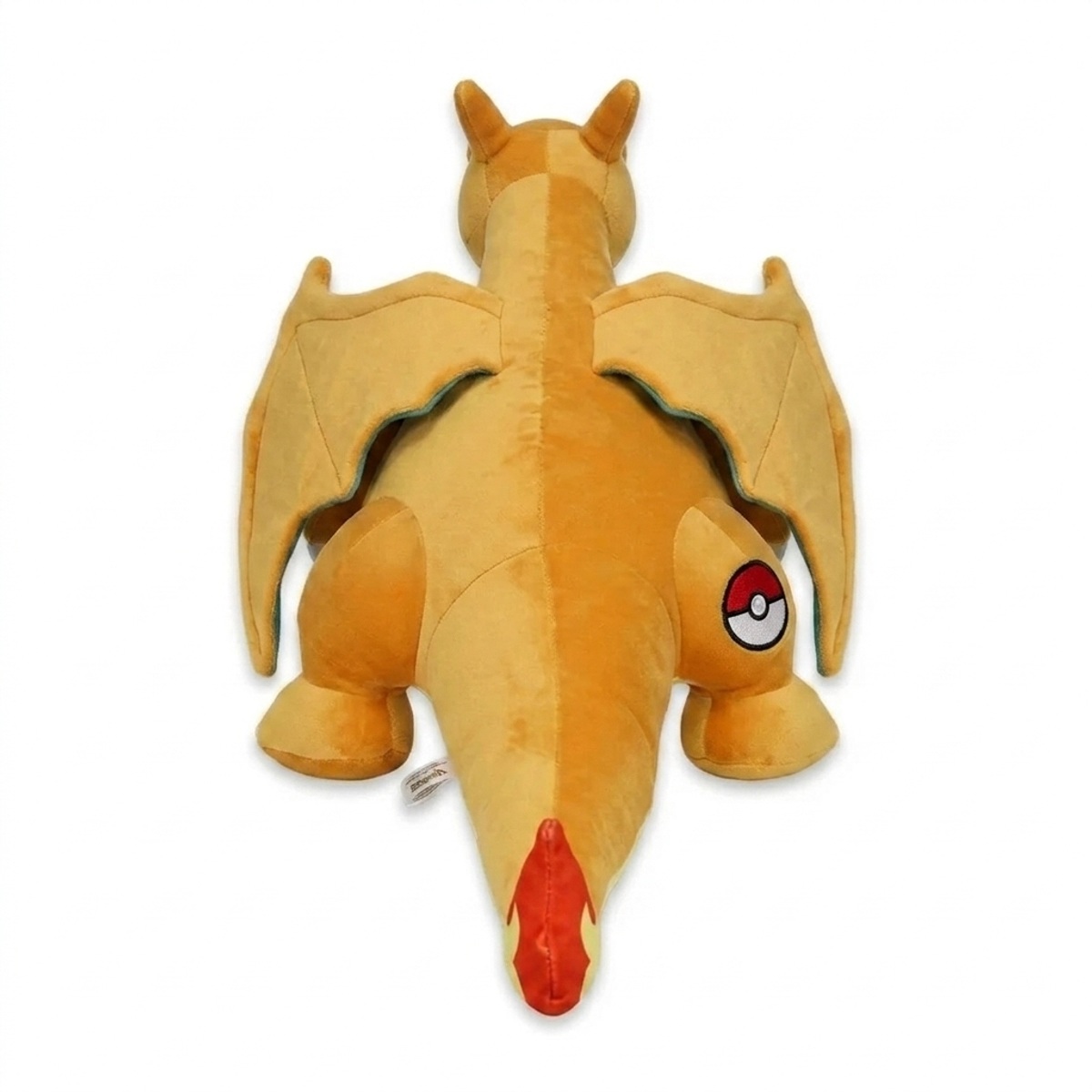 Peluche Charizard con distintivo che prova l'autenticità del prodotto.