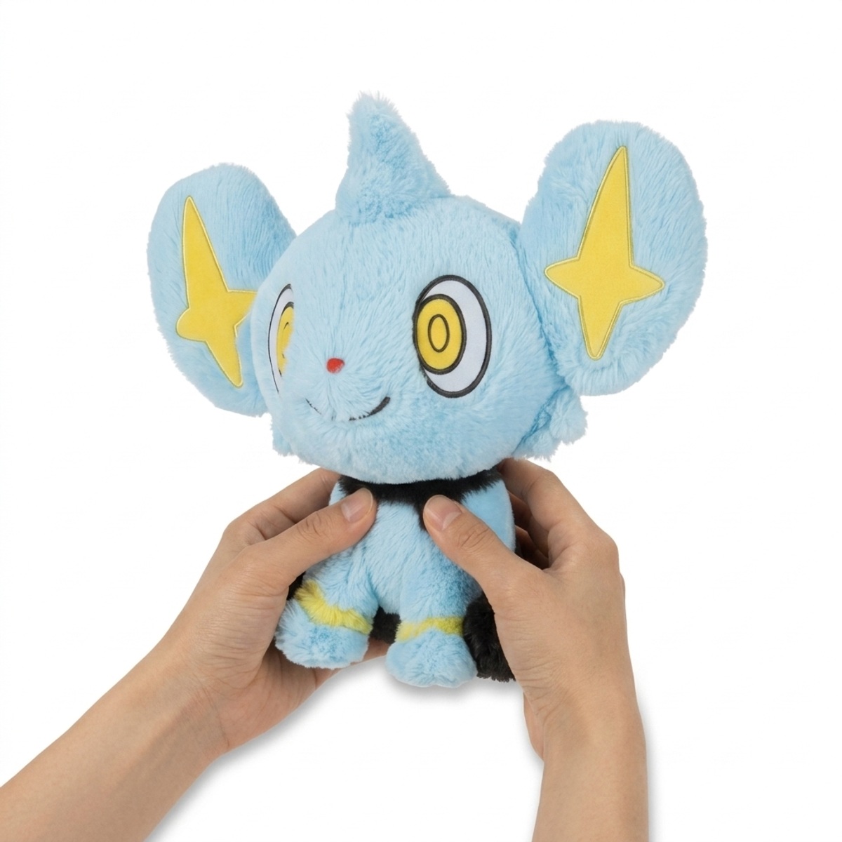Peluche Shinx tenuta nelle mani
