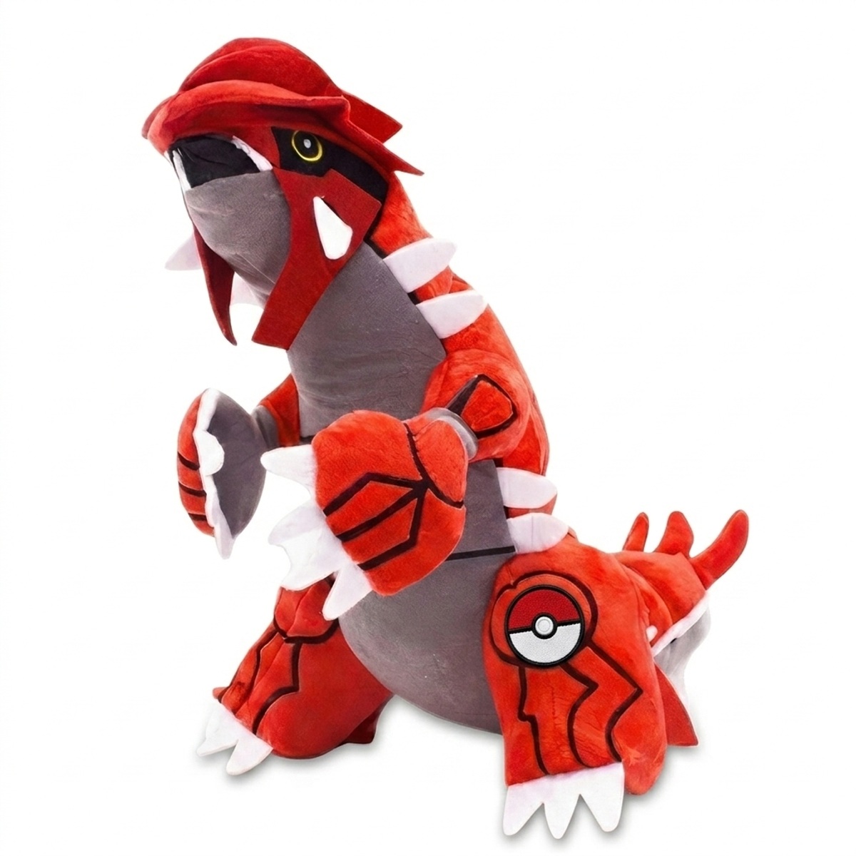 Peluche Groudon con distintivo che prova l'autenticità del prodotto.