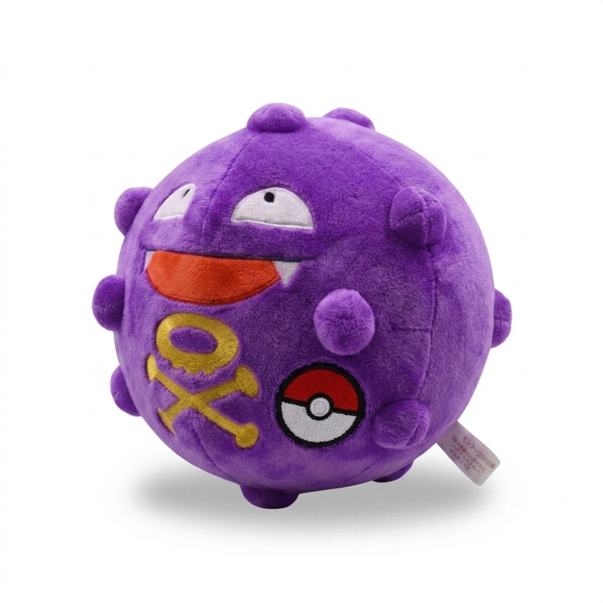 Peluche Koffing con distintivo che prova l'autenticità del prodotto.