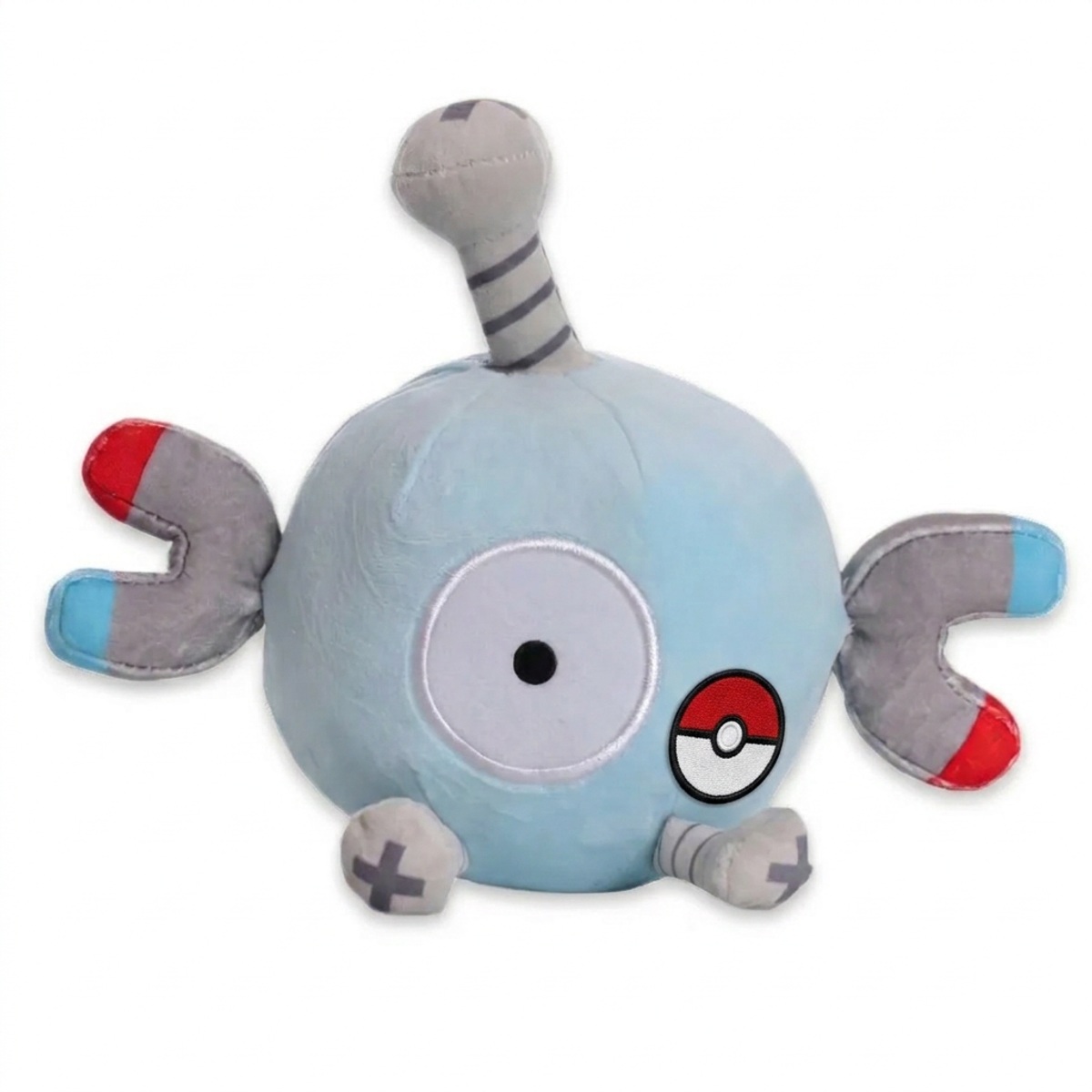 Peluche Magnemite con distintivo che prova l'autenticità del prodotto.