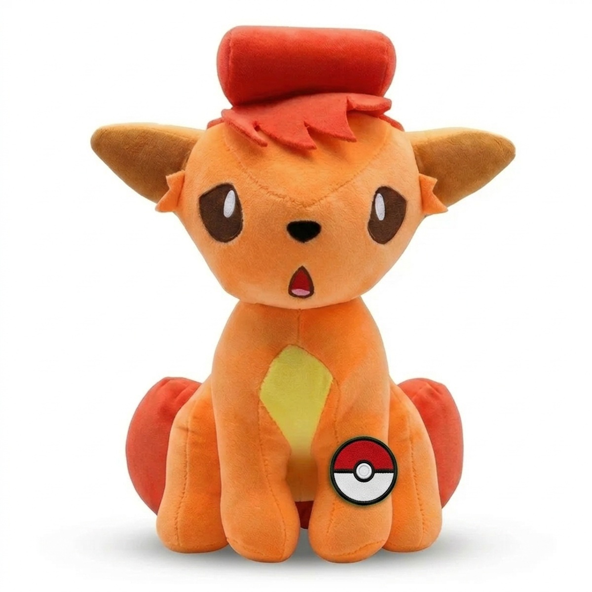 Peluche Vulpix con distintivo che prova l'autenticità del prodotto.