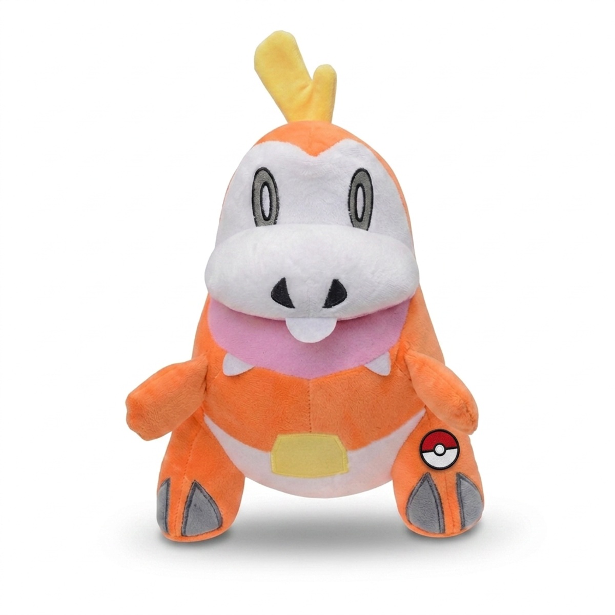 Peluche Fuecoco con distintivo che prova l'autenticità del prodotto.