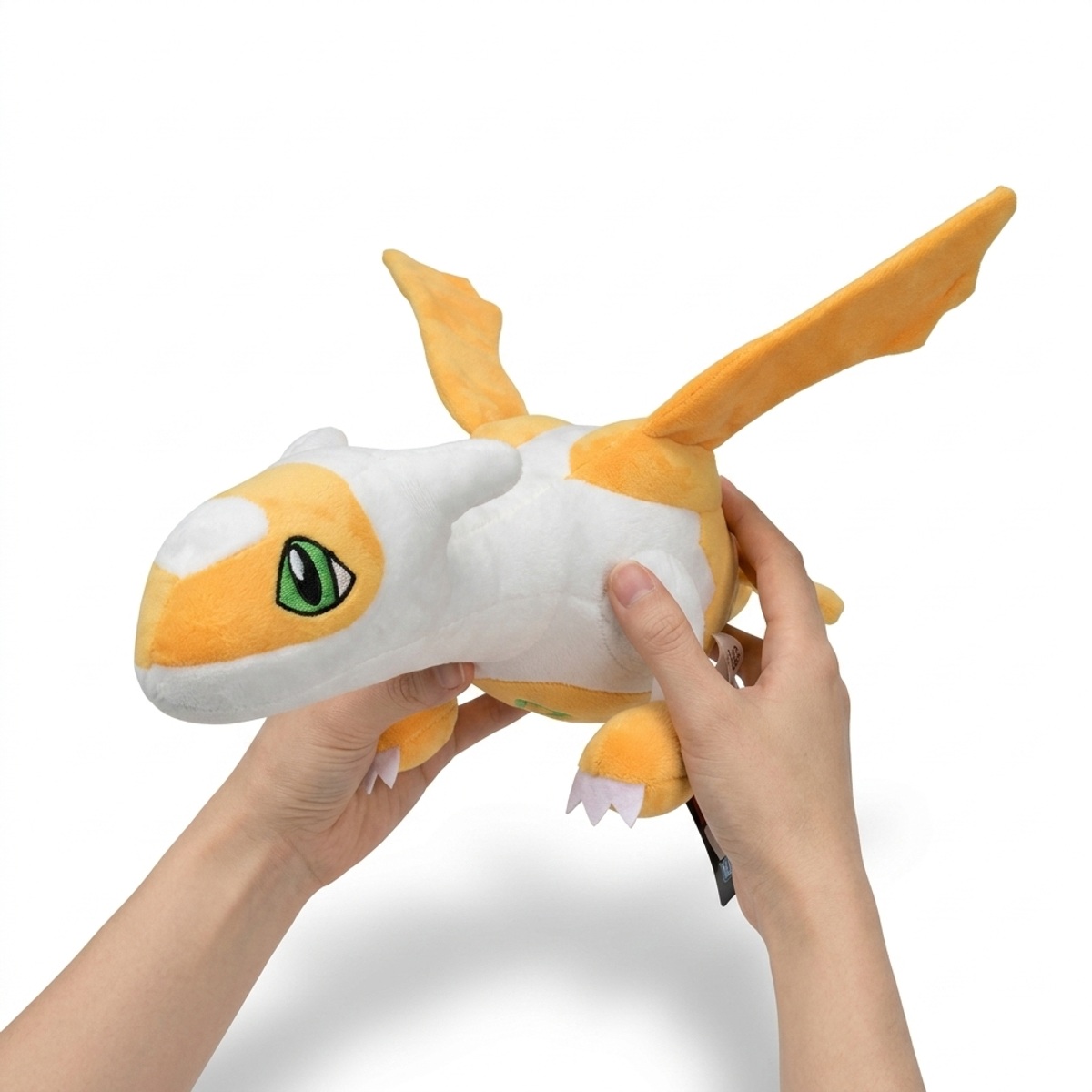 Peluche Latias Shiny tenuta nelle mani