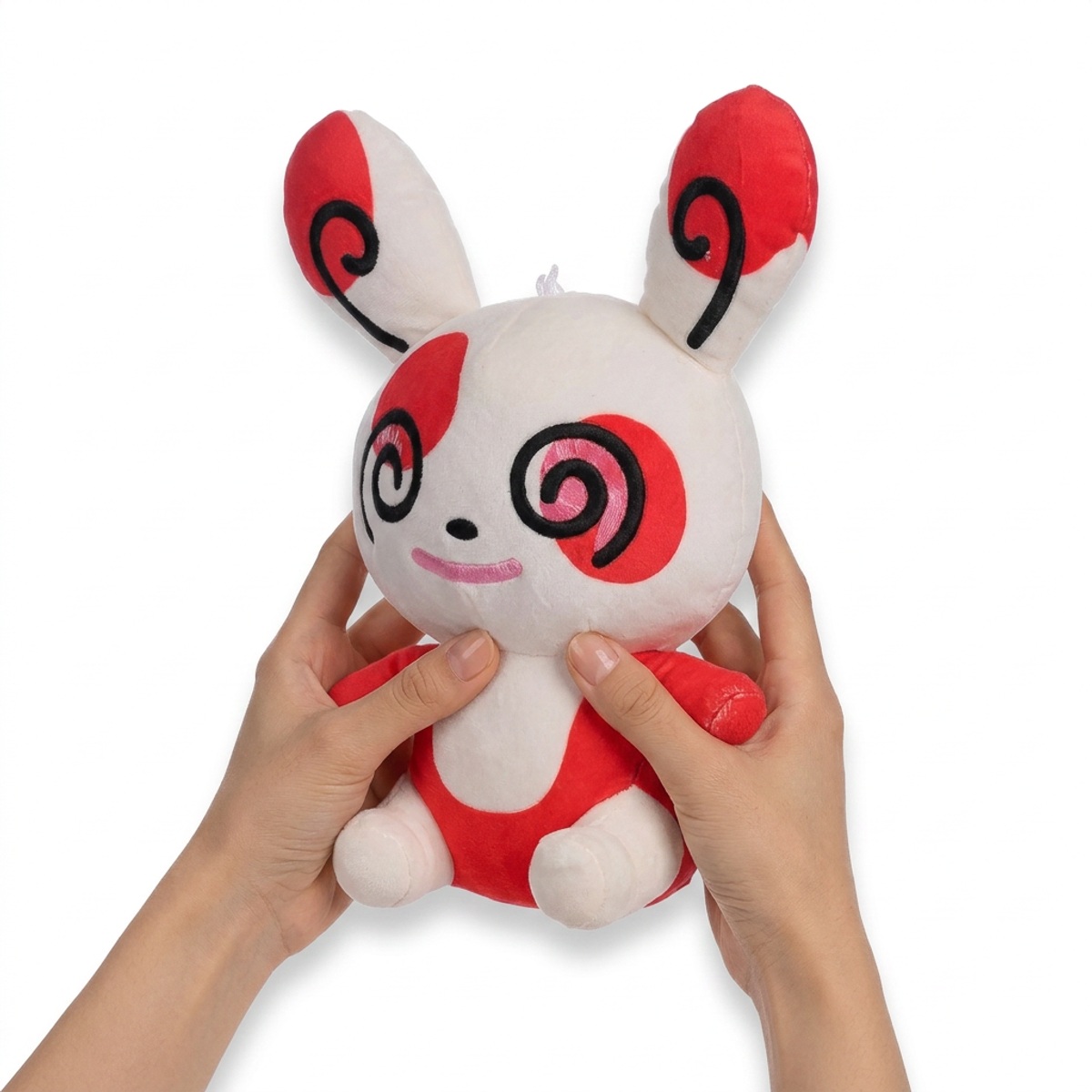 Peluche Spinda tenuta nelle mani