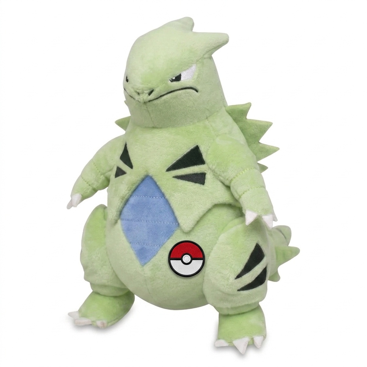 Peluche Tyranitar con distintivo che prova l'autenticità del prodotto.