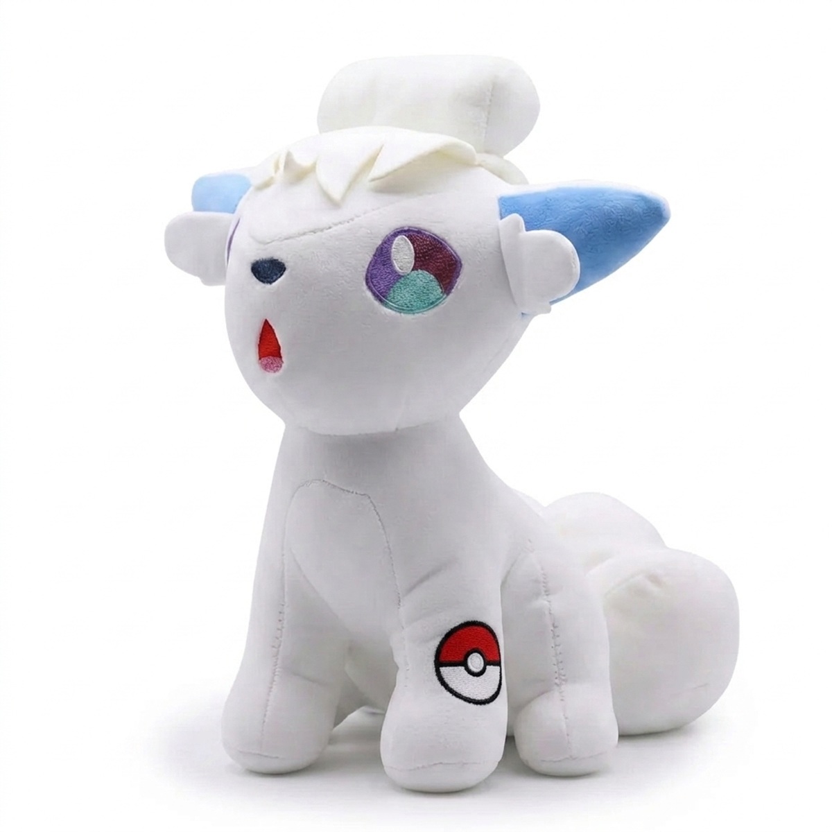 Peluche Vulpix con distintivo che prova l'autenticità del prodotto.